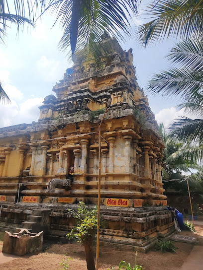 Devipattinam Navagraha sea stones with gentle waves and devotees